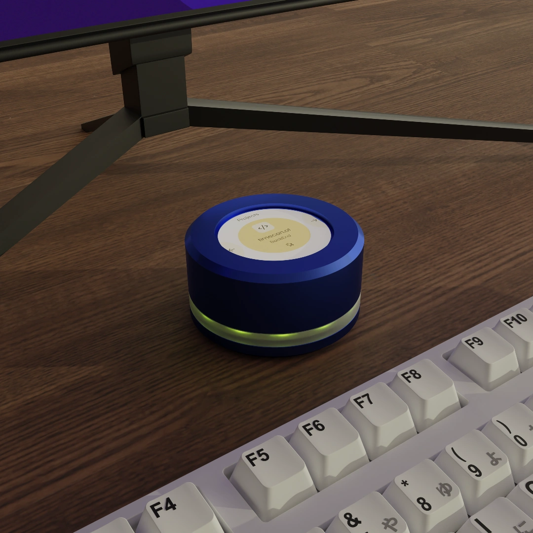 a blue round object on a table next to a keyboard